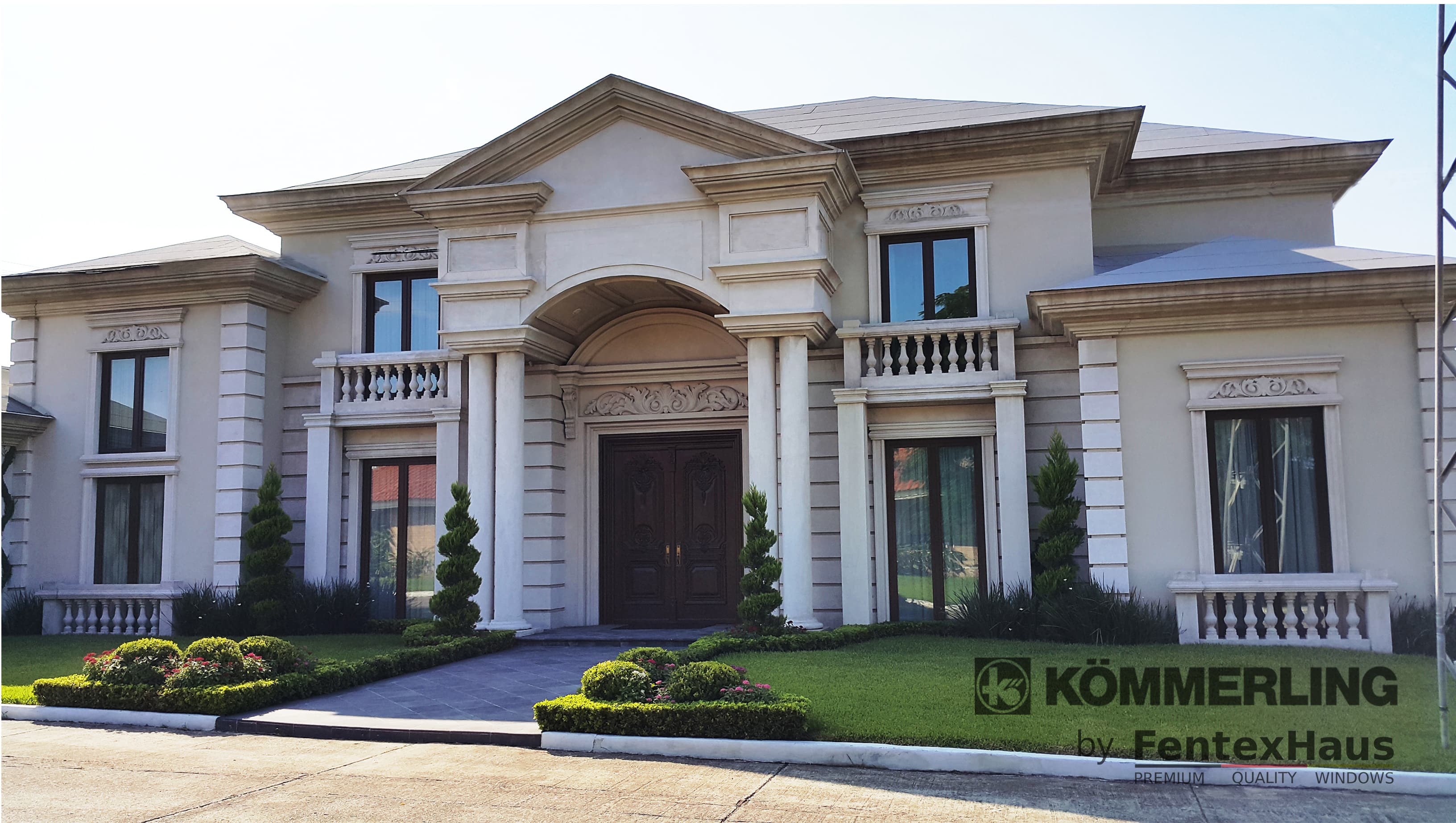 Ornate entrance with large door and decorative columns